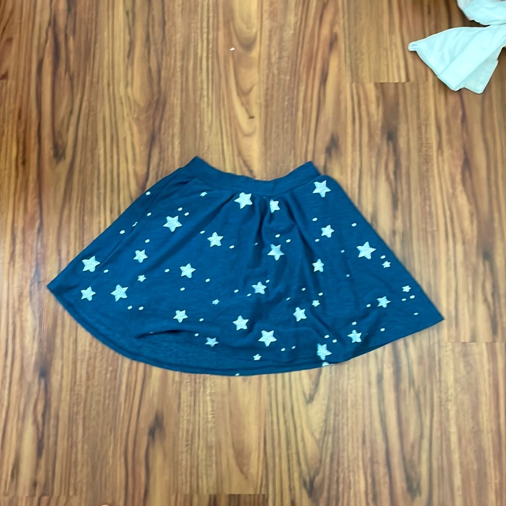 Blue skort with silver stars and pockets. Never worn